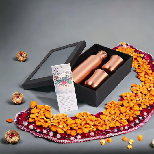 Mother copperware Curved Glass Bottle Gift Set with 2 Copper Glasses with Ayurvedic Health Benefits Used for Household and Gifting Purposes.Diwali Gift Sets